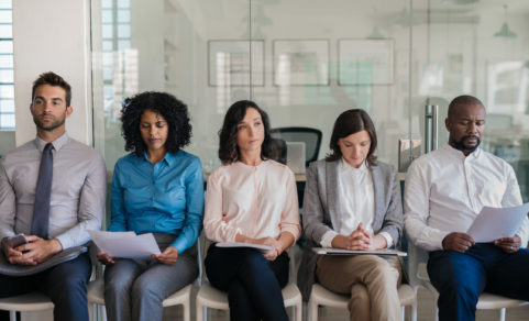 Job applicants waiting for their interviews in an office